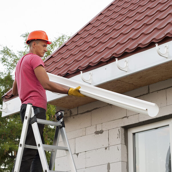 Installation Of Gutter System Seamless Rain Gutter Installation in Greeley, Colorado.